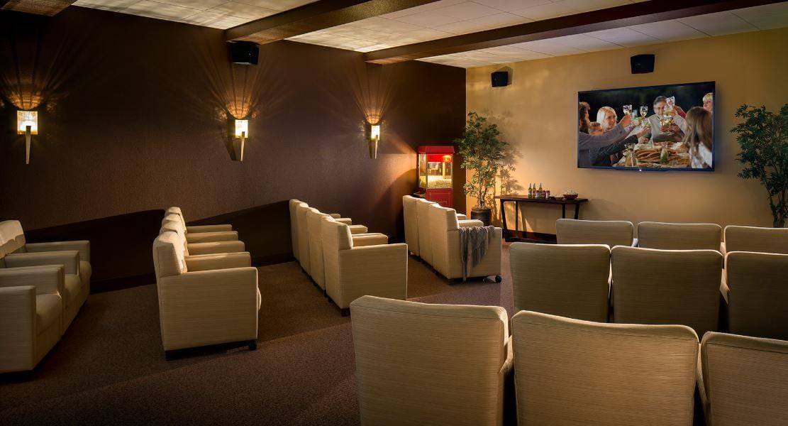 A luxurious home theater setup with comfortable seating and elegant decor.