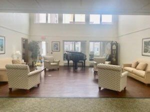 A spacious lobby with elegant seating and a grand piano.