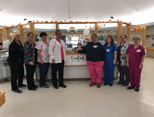 A dedicated team of healthcare professionals gathered together at their workplace.