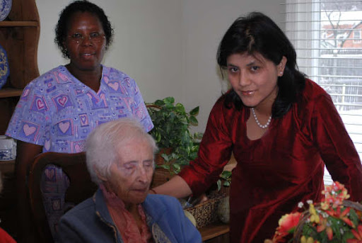 Caregivers providing support and companionship to elderly individuals.