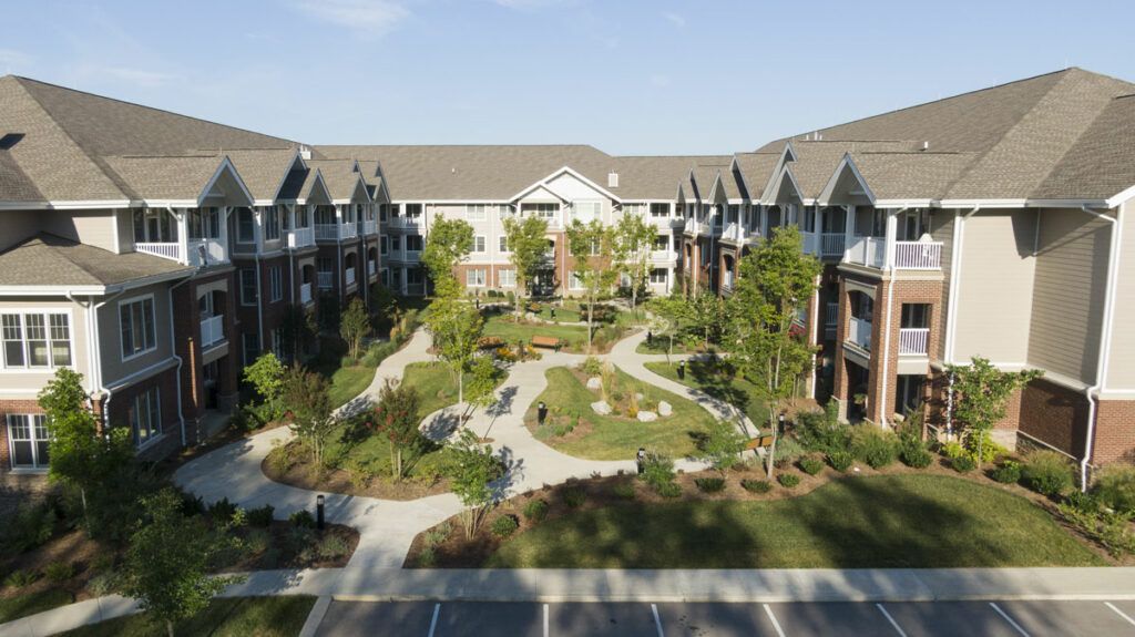 A modern apartment complex with a landscaped courtyard.