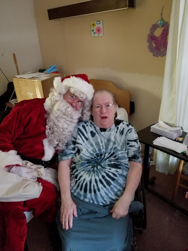 A cheerful moment with Santa Claus during the holiday season.