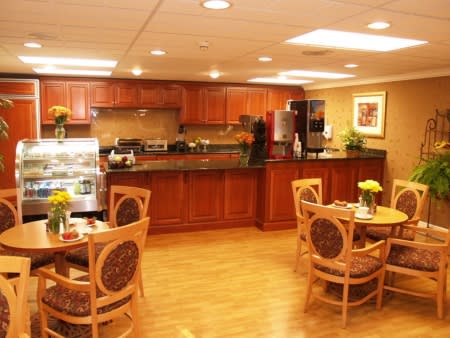 A cozy kitchen and dining area with wood furniture and modern design.