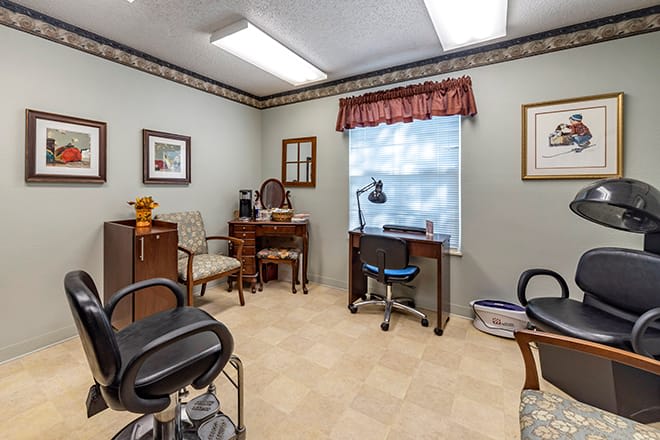 A clean and organized veterinarian office with chairs, medical equipment, and a welcoming atmosphere.