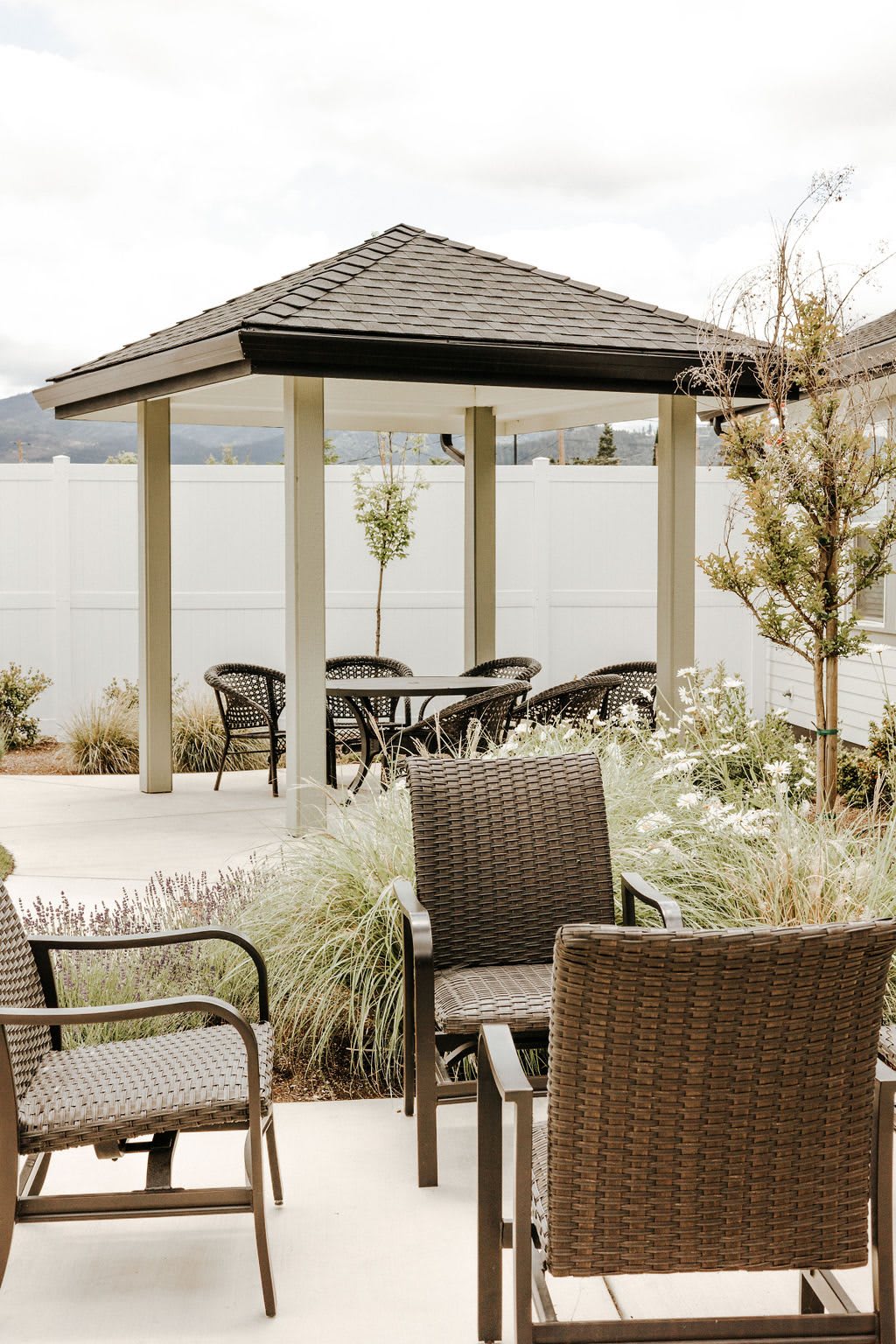 Outdoor patio area with a gazebo and seating arrangement.