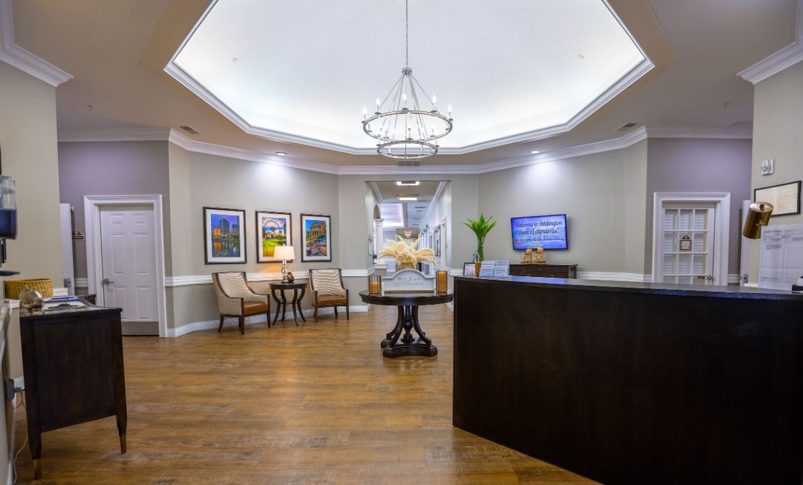 A modern reception area with seating and elegant decor.