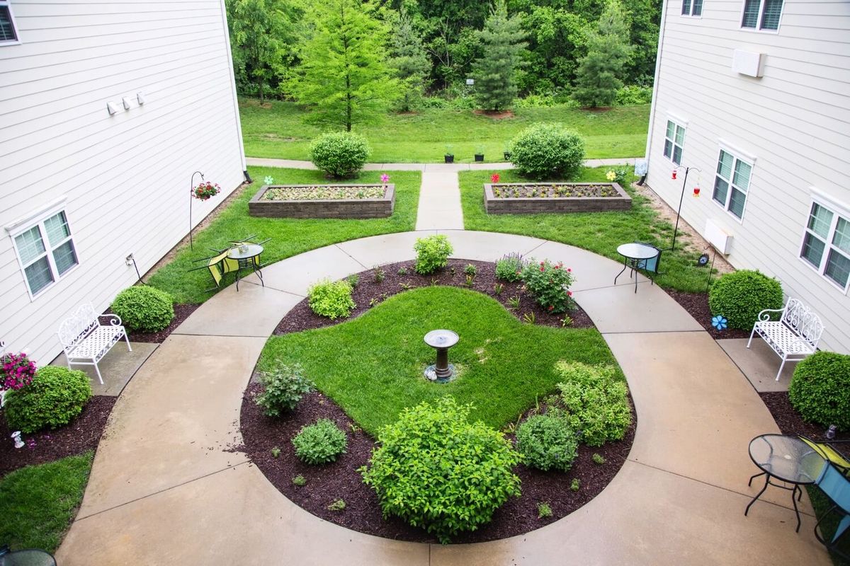 A landscaped courtyard with pathways and greenery.