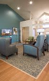 A cozy living room with comfortable seating and a television.