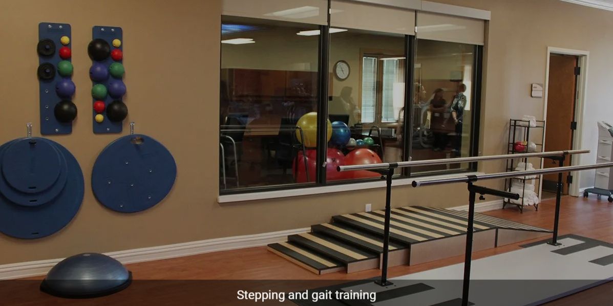 A physical therapy room equipped with stairs and exercise balls.