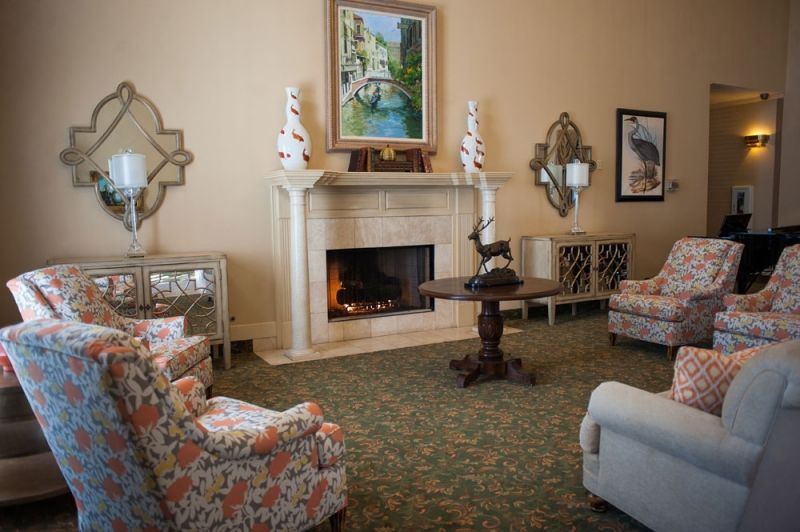A cozy living room with elegant furniture and a fireplace.
