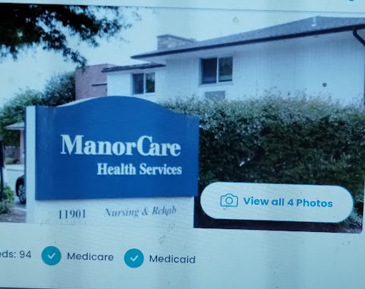 A sign for ManorCare Health Services, indicating it's a healthcare facility offering services like nursing and Medicare.