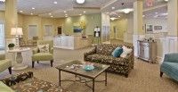 A cozy lobby with comfortable seating and a reception desk.