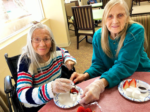 Enjoying a fun cooking activity together at the care home.