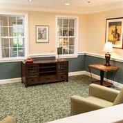 A cozy living room with elegant furniture and soft lighting.