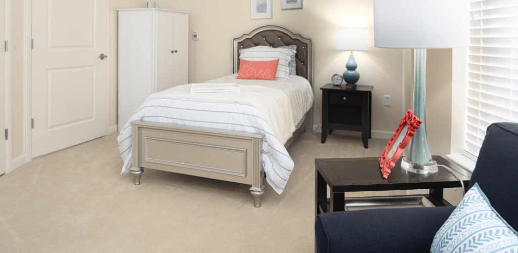 A cozy bedroom with a single bed and modern decor.
