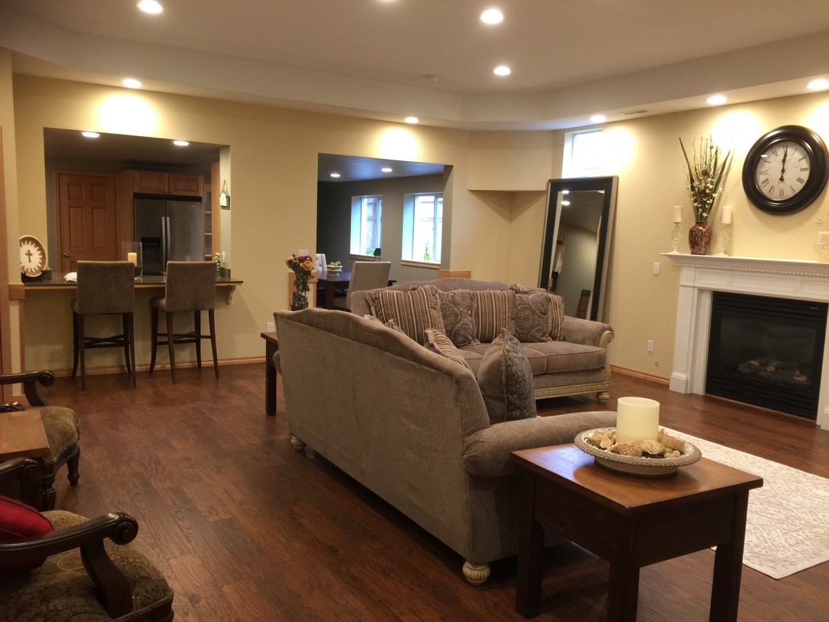 A cozy living room with comfortable seating and a fireplace.