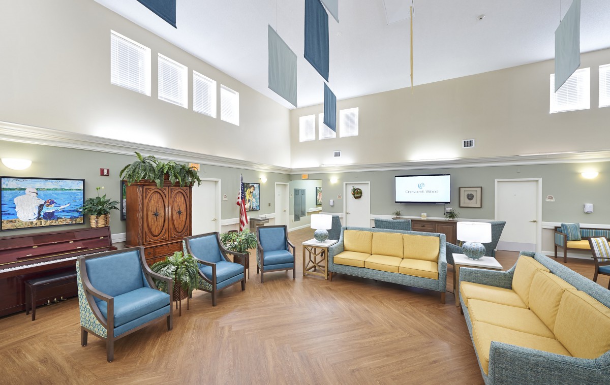 A modern waiting room with comfortable seating and natural light.