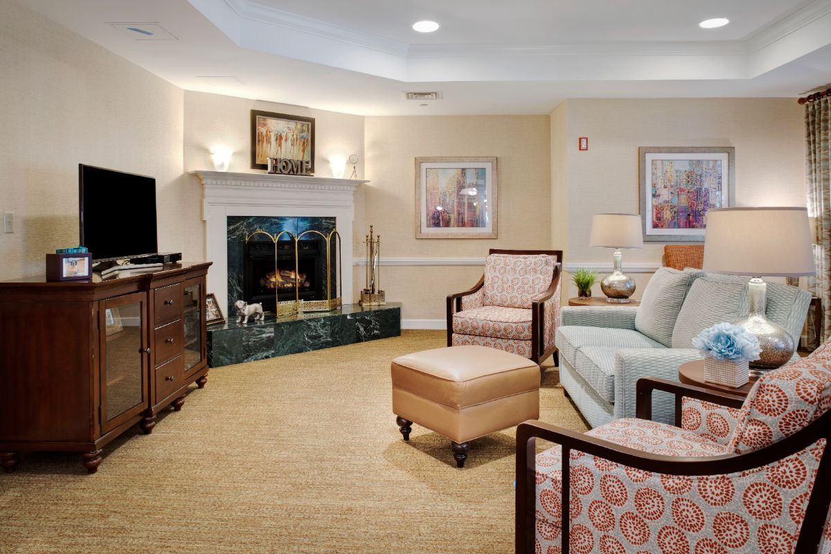 A cozy living room with comfortable seating and a fireplace.