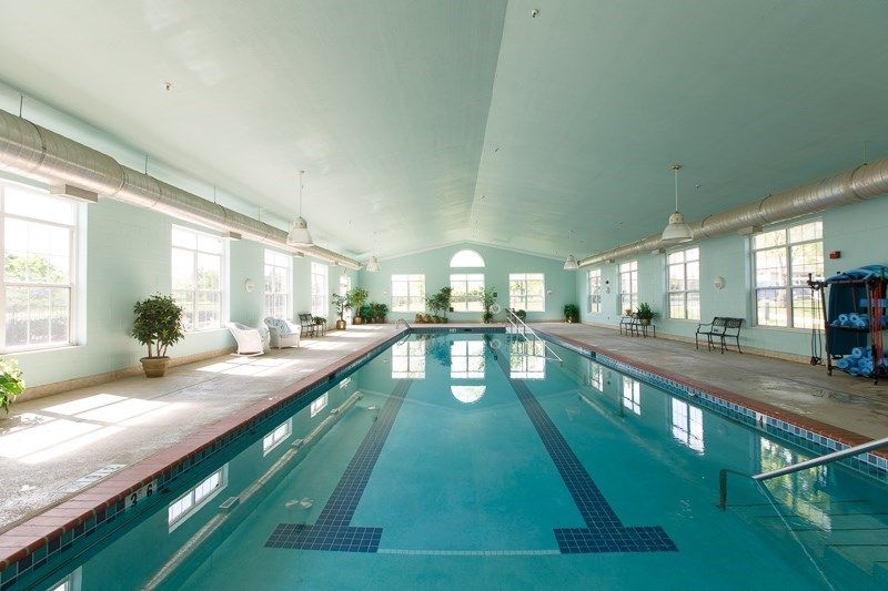 Spacious indoor swimming pool with elegant design and abundant natural light.