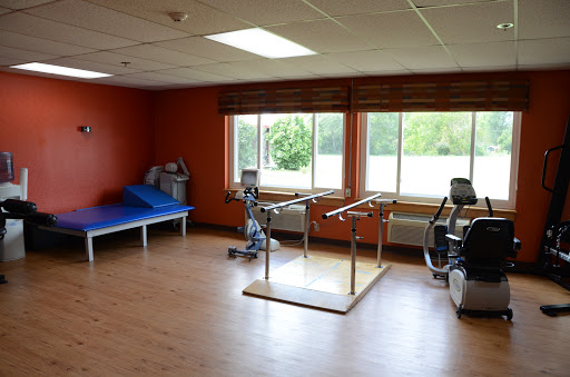 A well-equipped physical therapy room designed for rehabilitation and exercise.
