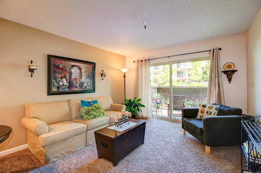 A cozy and inviting living room featuring modern furniture and ample natural light.