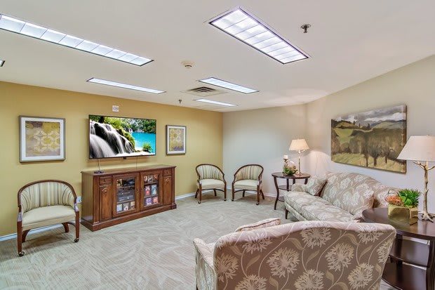 A cozy living room with comfortable seating and a television.