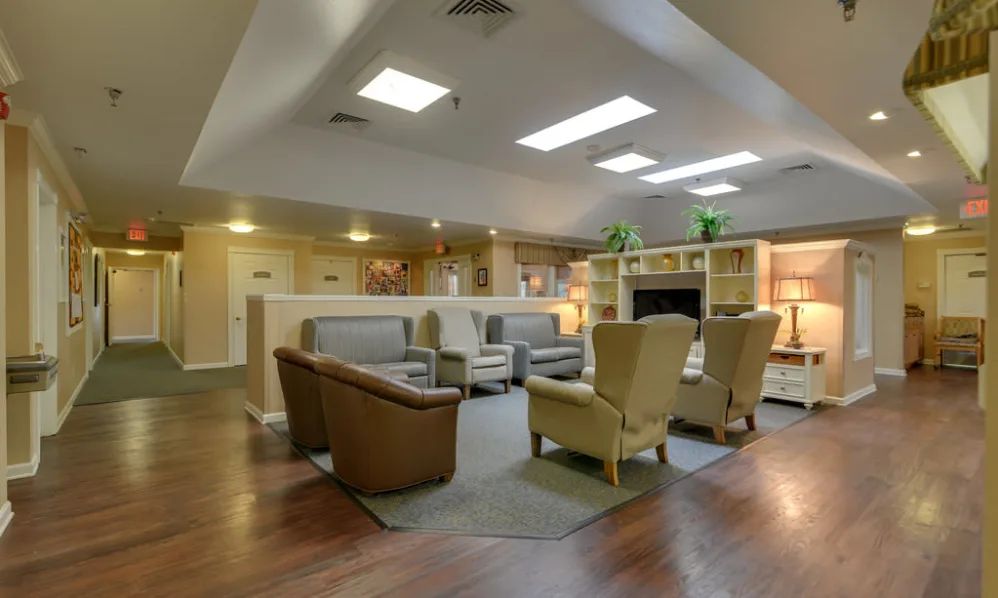 A cozy and modern lobby seating area with comfortable chairs and ambient lighting.