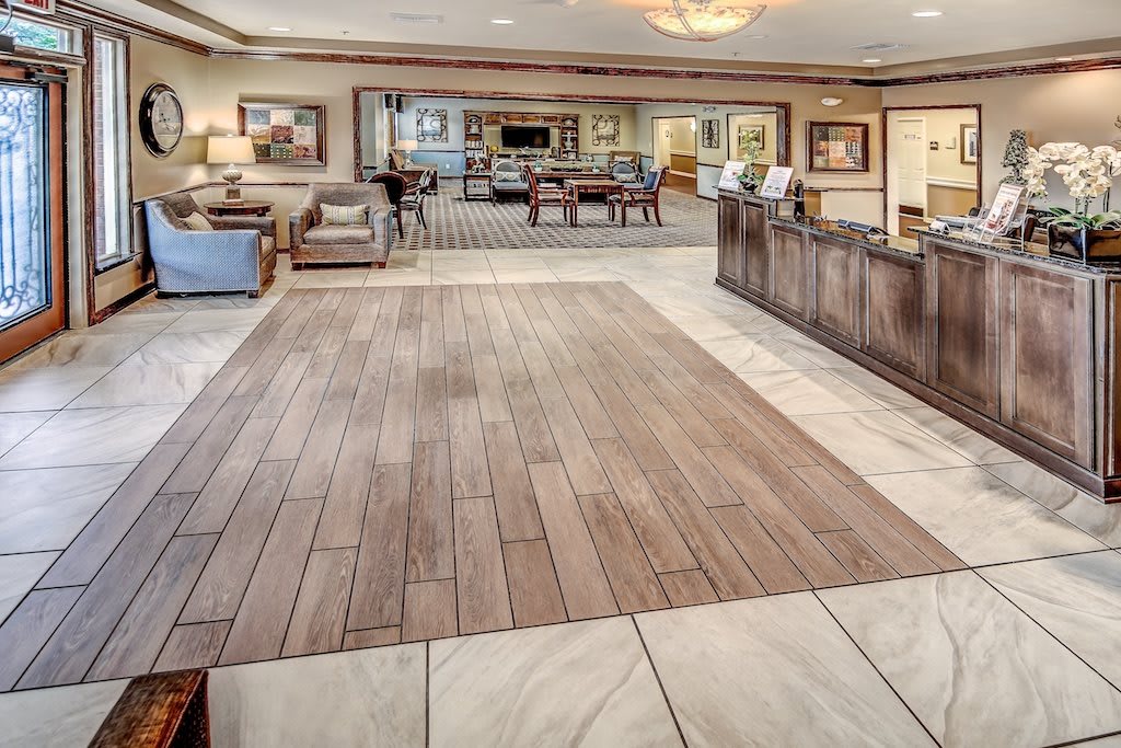 A spacious and elegantly designed lobby with comfortable seating and a welcoming reception desk.