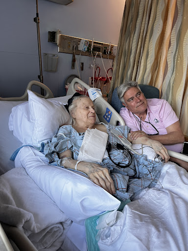 A touching moment between a patient and their loved one in a hospital setting.