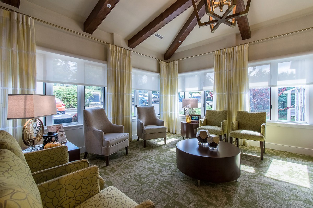 A cozy living room with comfortable seating and ample natural light.