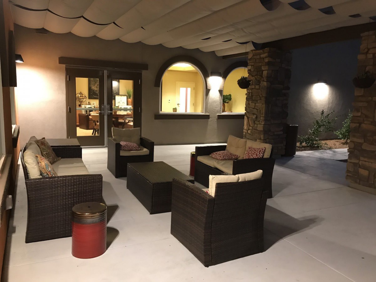Cozy outdoor patio with comfortable seating at night.