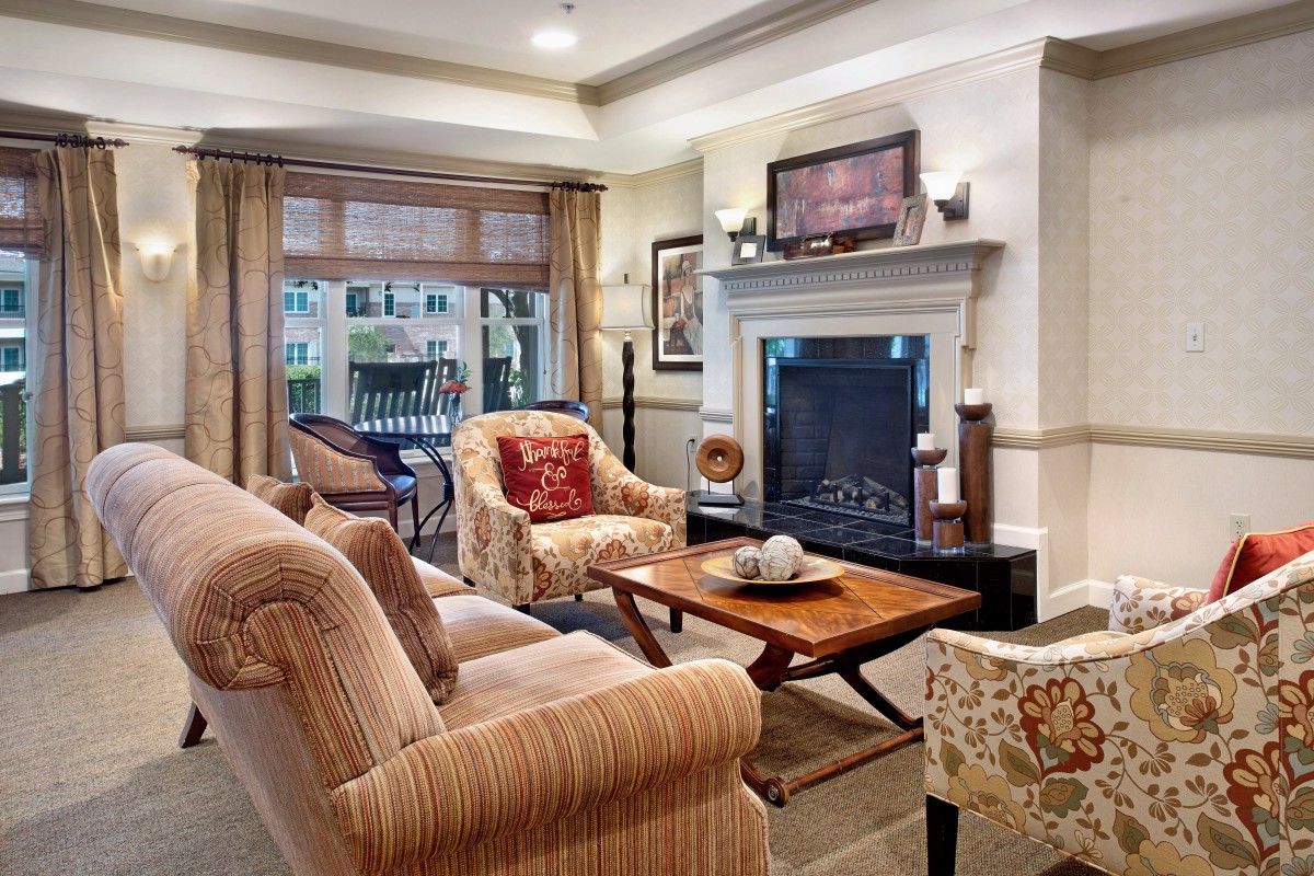 A cozy living room with elegant furniture and a fireplace.