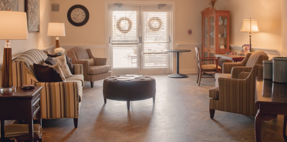 A cozy living room with comfortable seating and natural lighting.