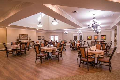 A spacious dining area with elegant decor and ample seating.
