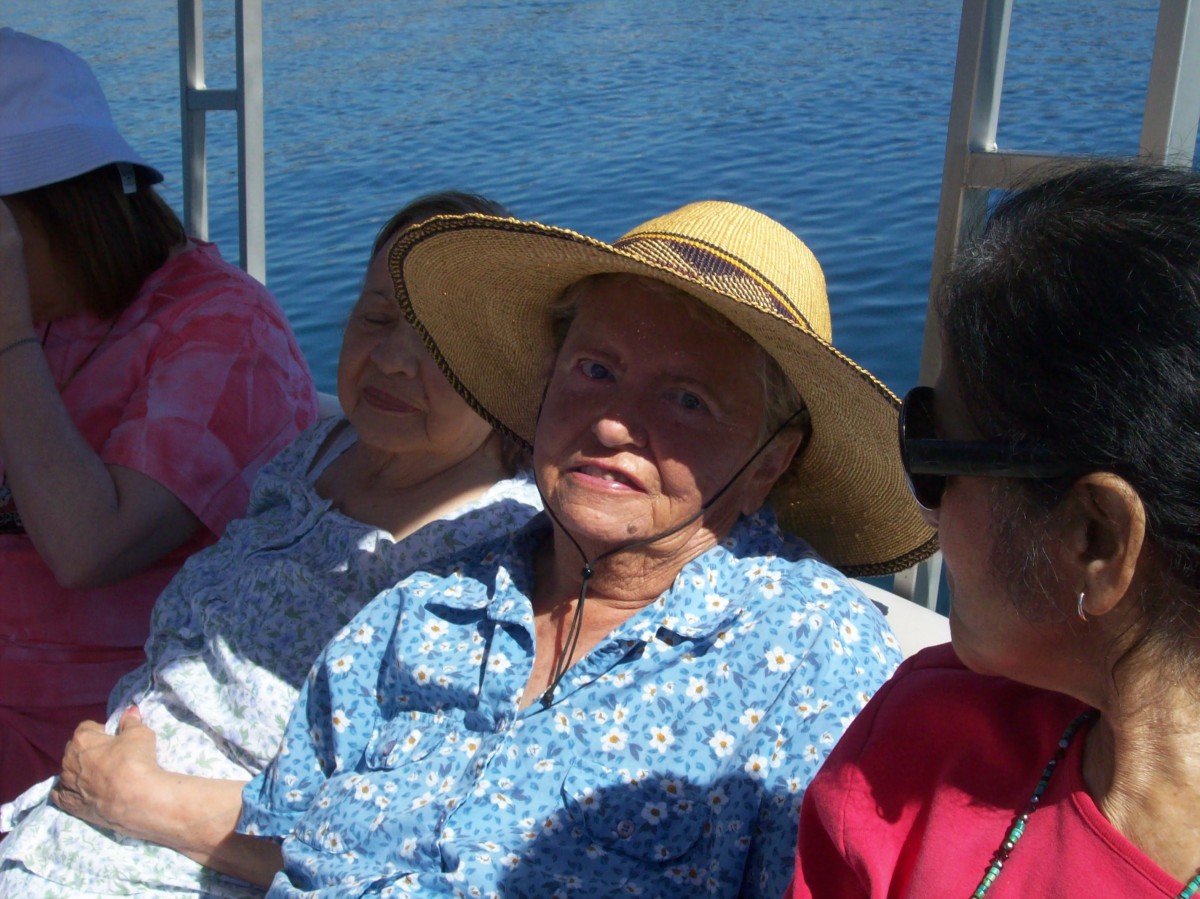 People relaxing on a boat under the sun.