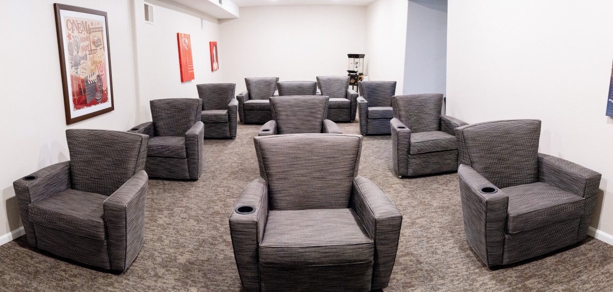 A room filled with comfortable armchairs arranged for a meeting or lounge setting.