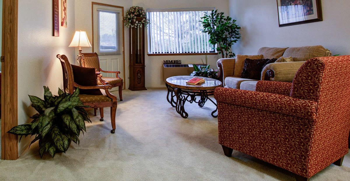 A cozy living room with comfortable seating and tasteful decorations.