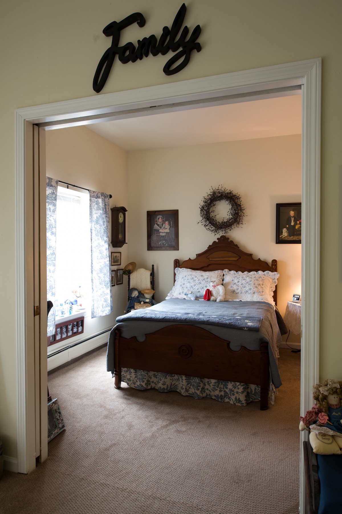 A cozy bedroom with classic wooden furniture and decorative accents.