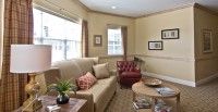 A cozy living room with comfortable seating and natural light.