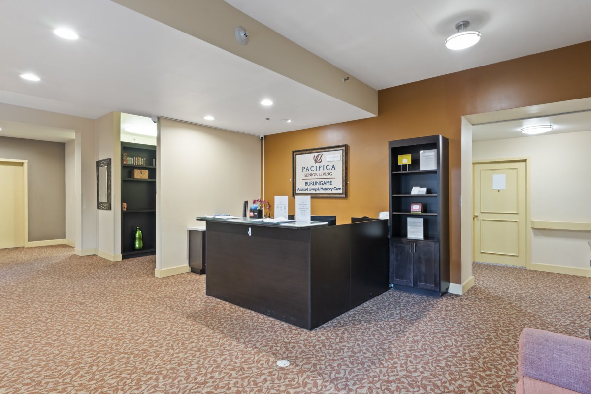A welcoming reception area with a central desk and comfortable surroundings.