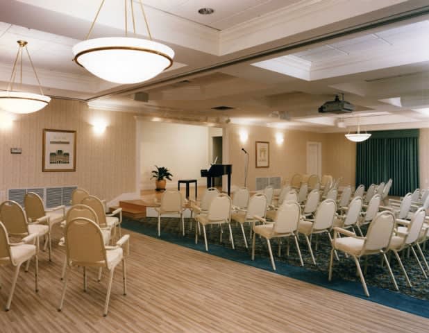 Empty conference room set up with chairs for an event.