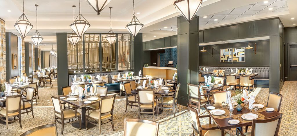 A stylish and well-lit restaurant interior with elegant furniture and dcor.