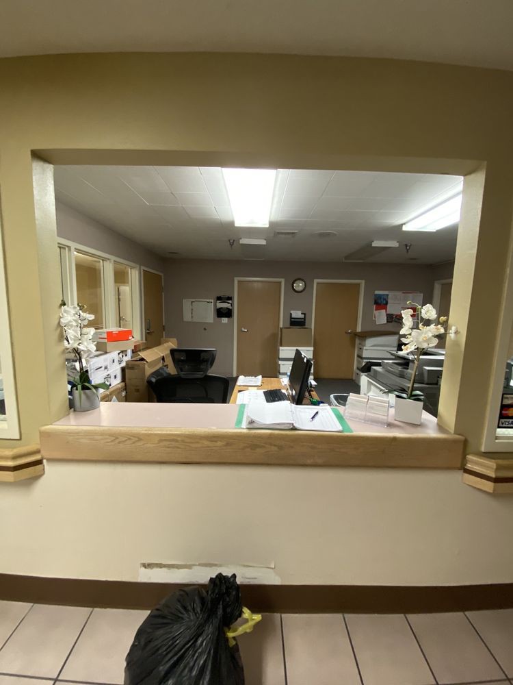 A view of a reception desk and office workspace.