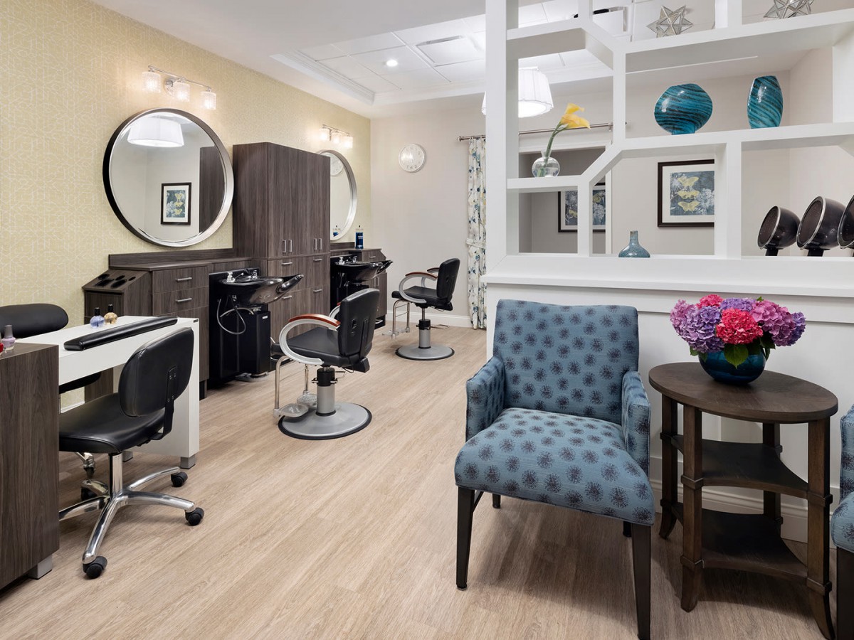 A modern salon interior featuring stylish hairdressing stations and comfortable seating.