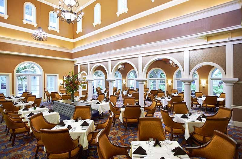 An elegant dining area with stylish decor and neatly arranged tables.