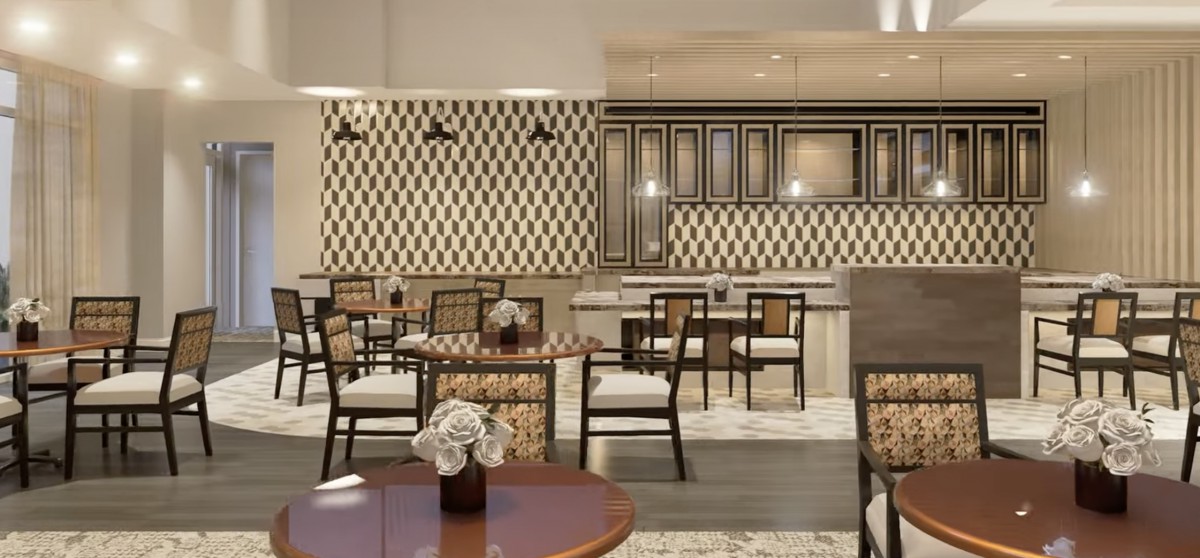 A modern restaurant interior featuring elegant decor and a cozy seating area.