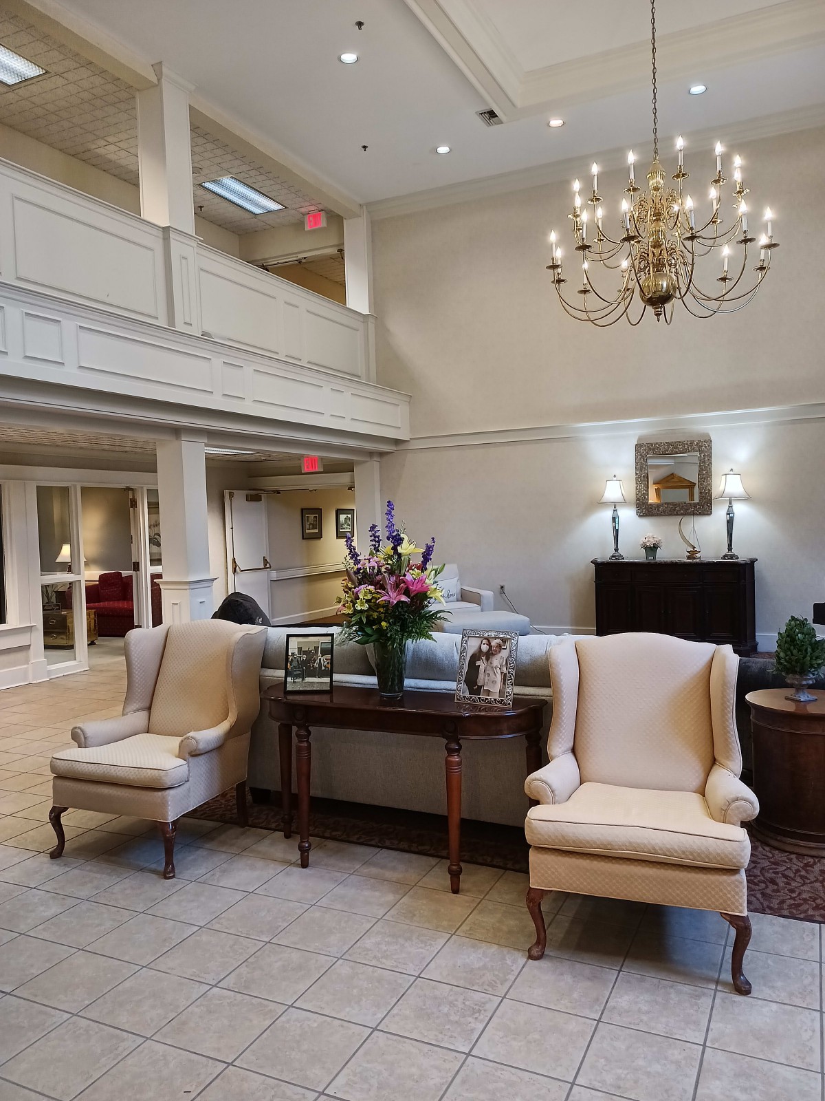 A luxurious lobby with elegant furniture and a chandelier.