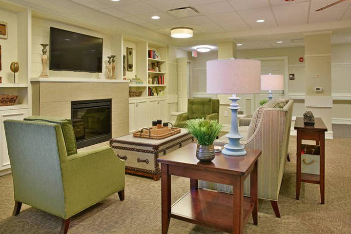 A cozy living room with comfortable seating, a fireplace, and tasteful decor.