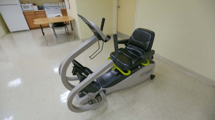 A recumbent exercise bike in a fitness facility.