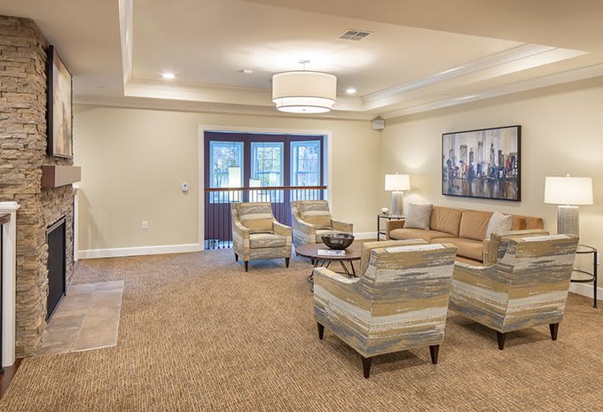A cozy living room with modern furniture and warm lighting.